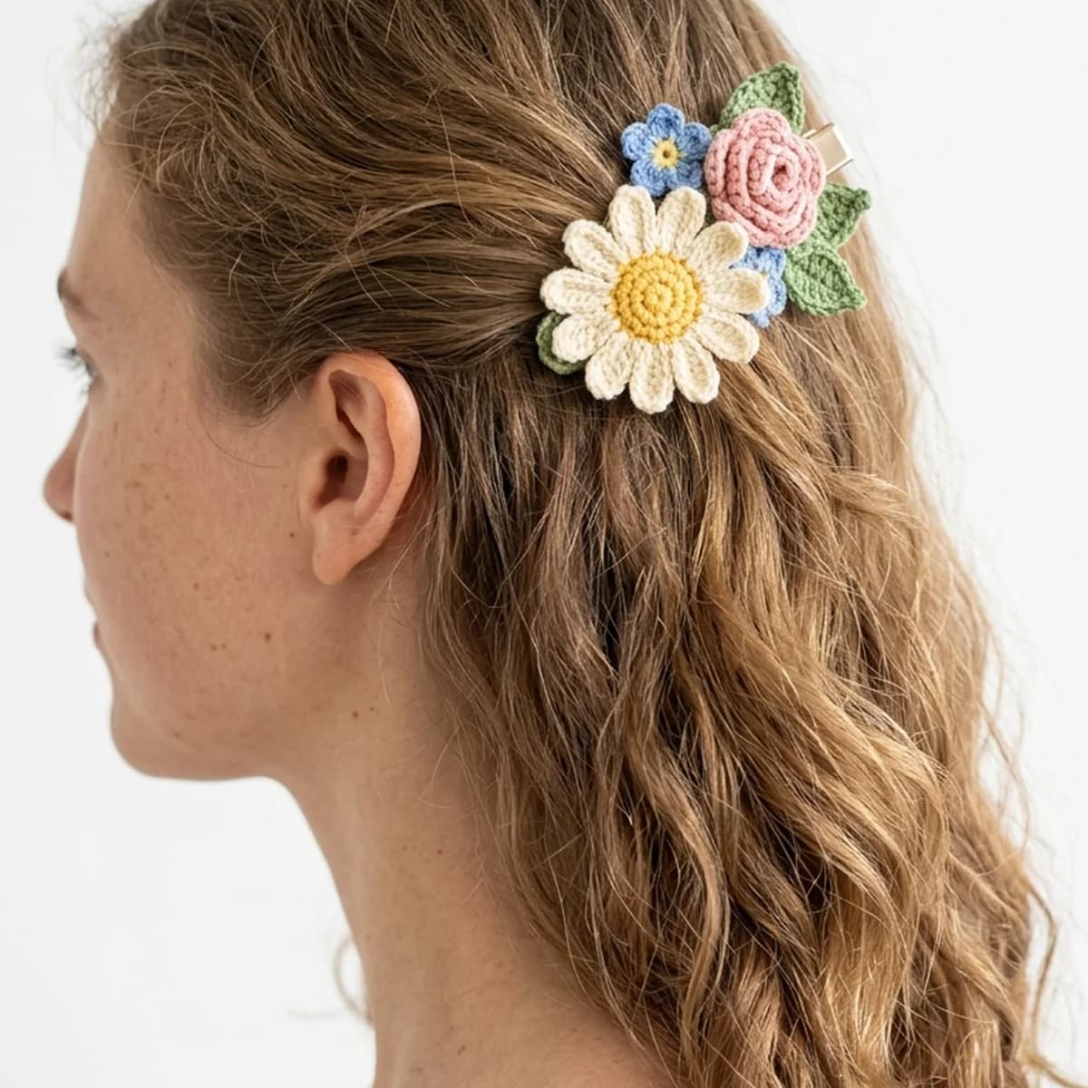 Beautiful handmade flower crochet hair clip in pink and green colors on a metal clip