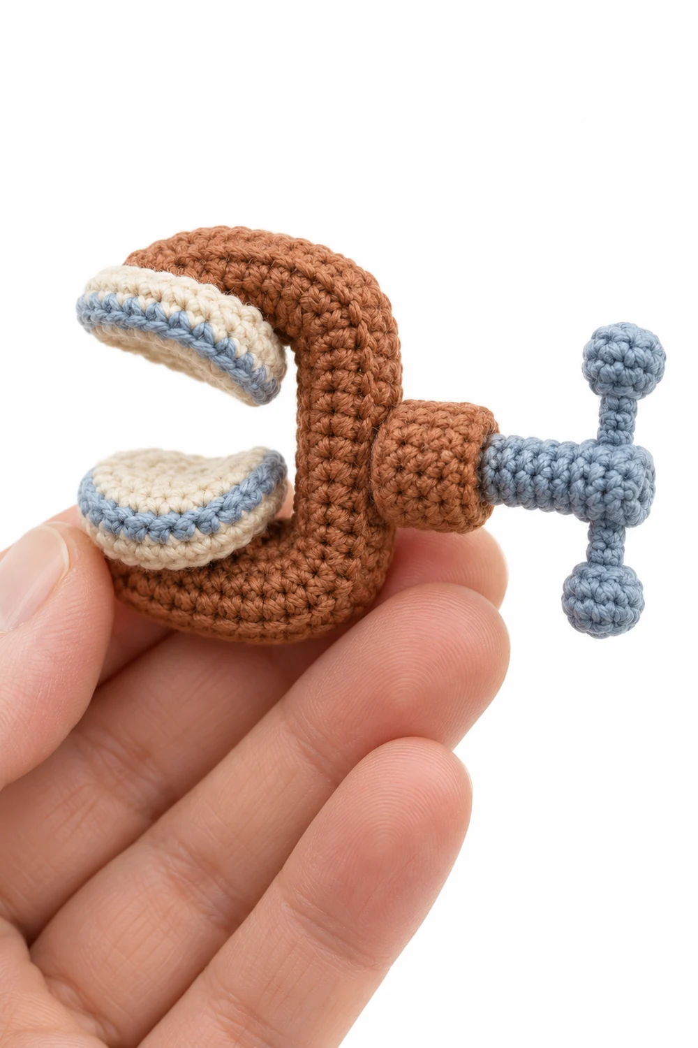 Miniature cinnamon crochet ceramic repair clamp