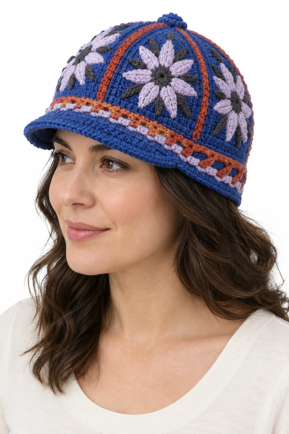 Cobalt blue crochet cap with compass petal paneled crown and short brim