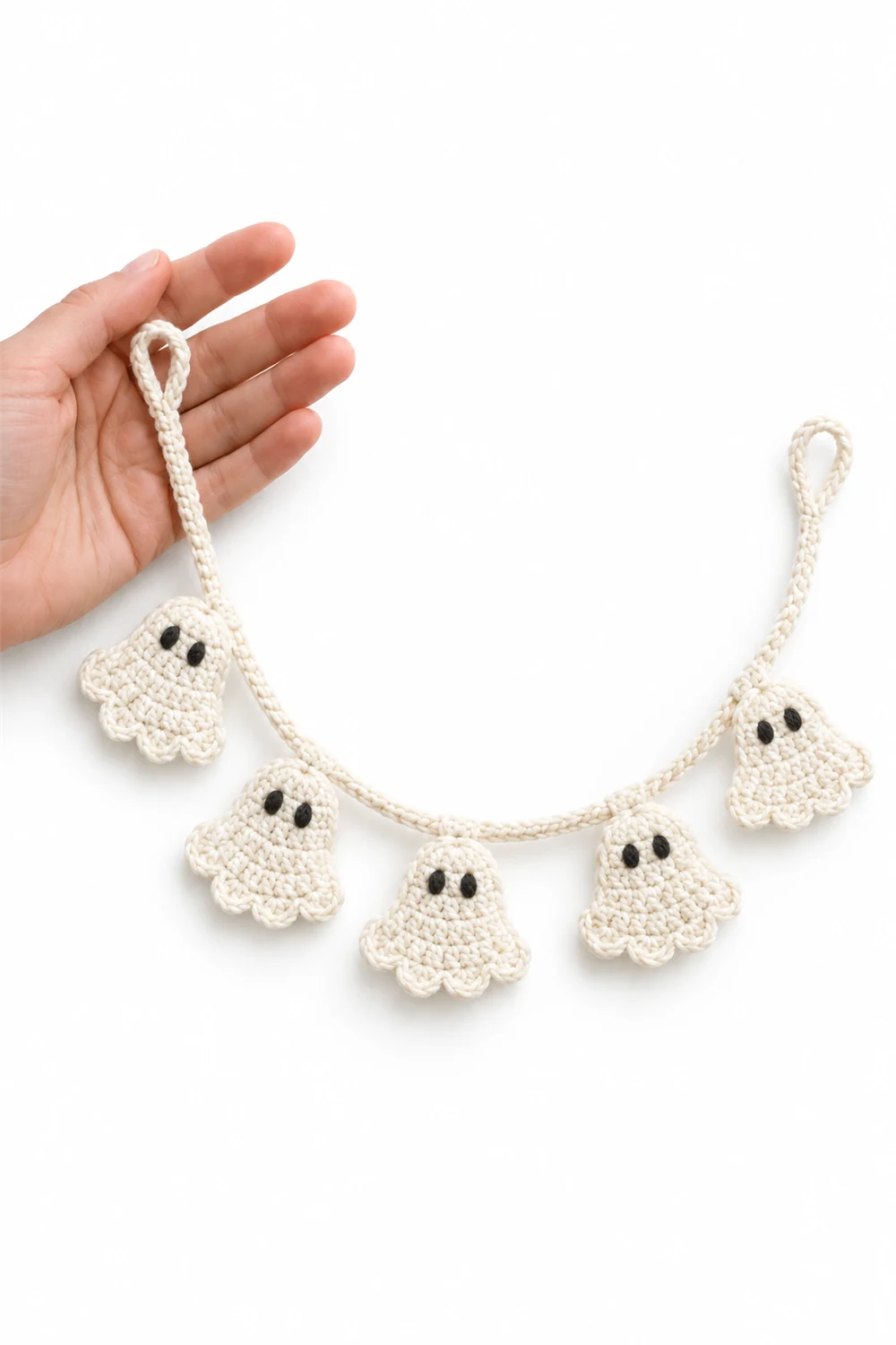 Crochet Halloween bunting with small white ghost flags