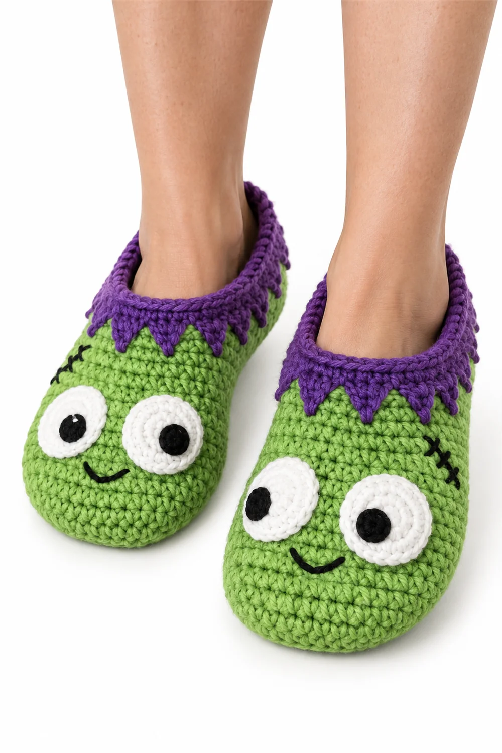 Green crochet monster slippers with eyes and teeth