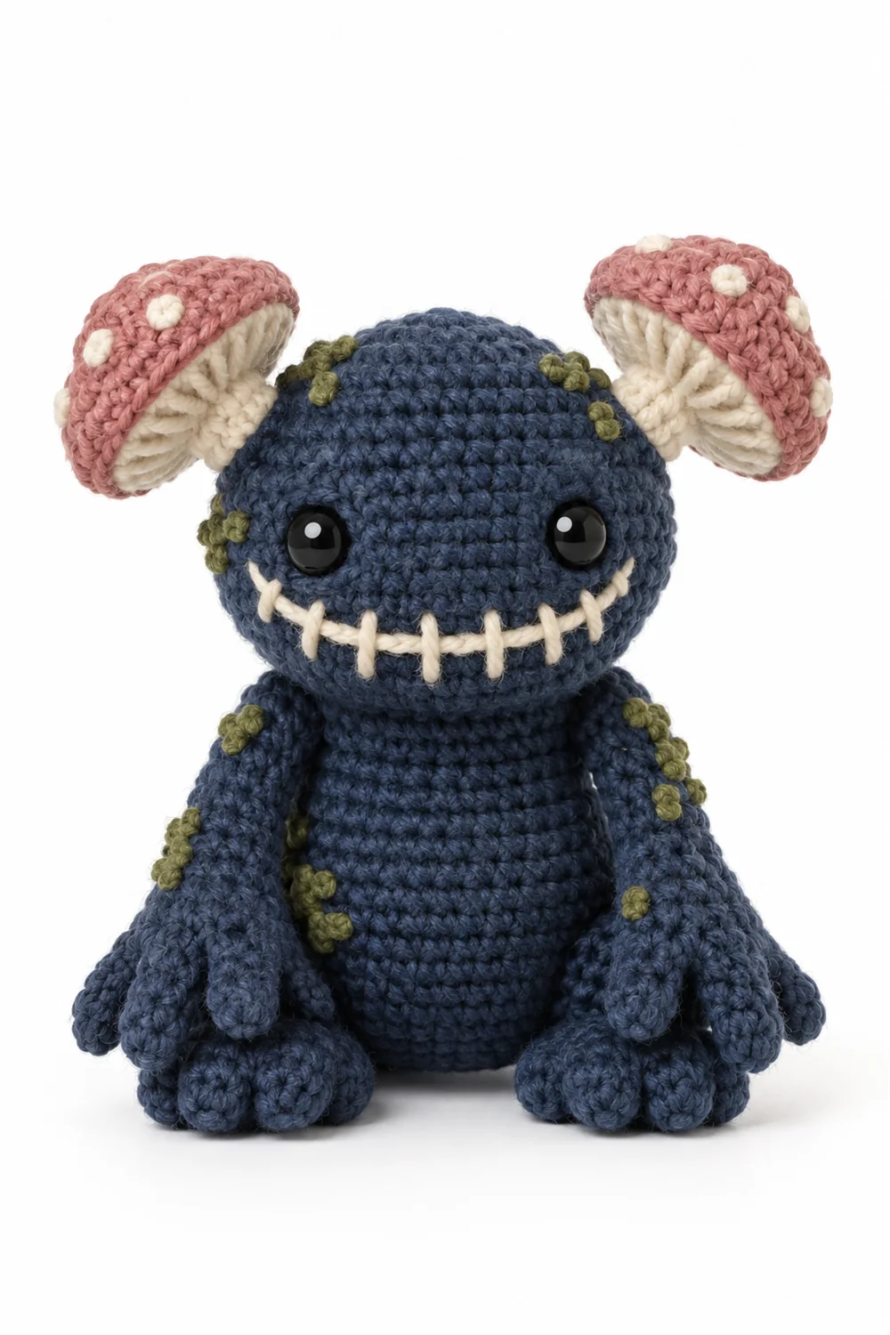 Navy blue crochet swamp monster with mushroom-shaped ears