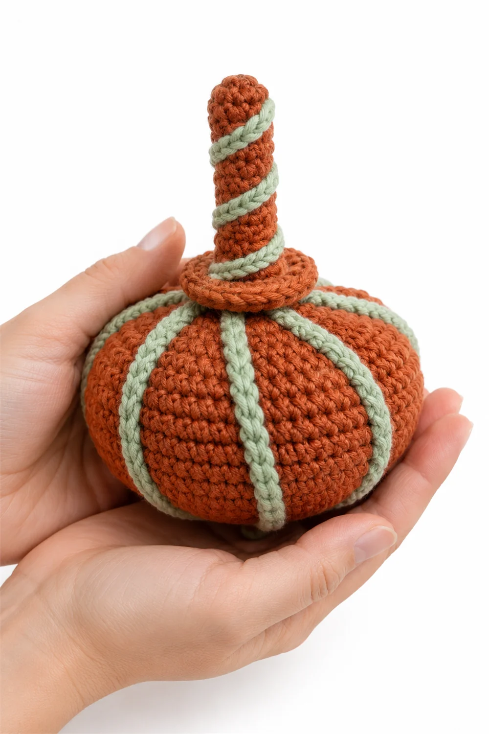 Rust orange crochet pumpkin-shaped spinning top