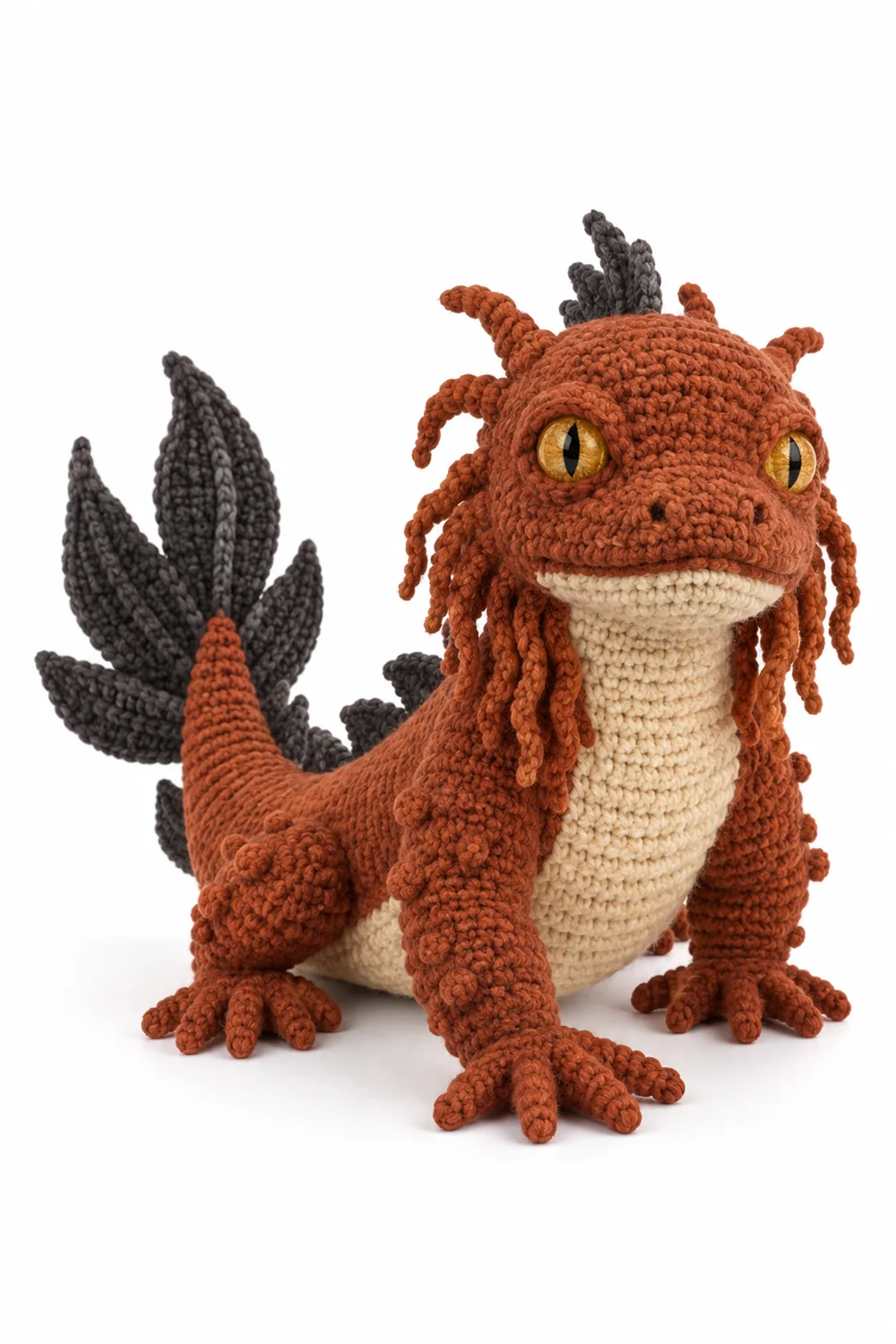 Rust orange crochet swamp monster with reed-like tail